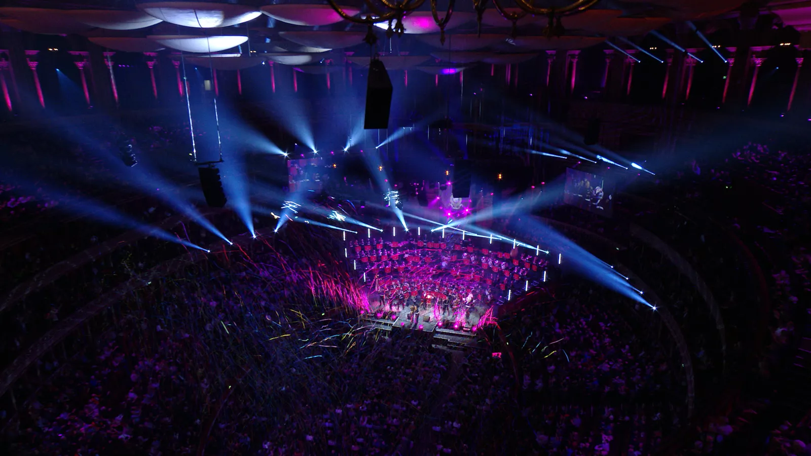 The Massed Bands of HM Royal Marines under stage lighting at the Royal Albert Hall, Mountbatten Festival of Music